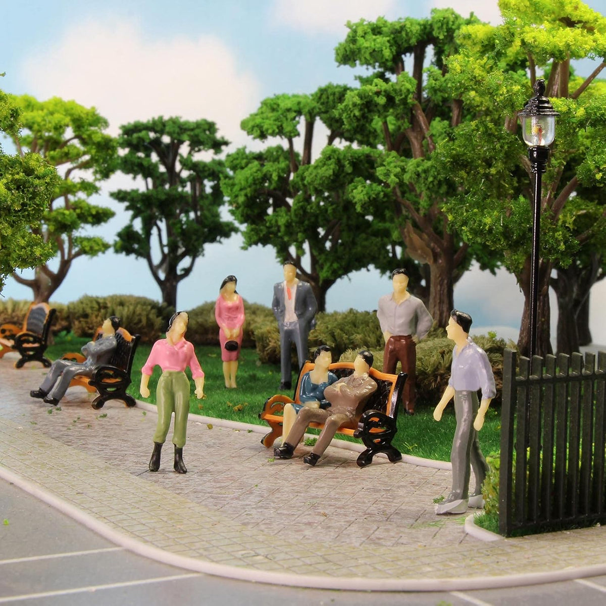 Miniature seated and standing figures for model displays