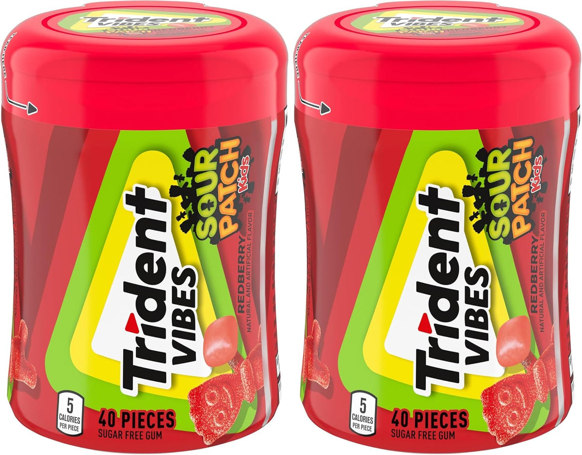Trident Vibes candy coated sugar free gum pieces held in a hand