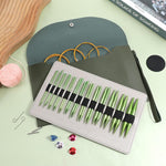 PU leather storage bag containing organized knitting components