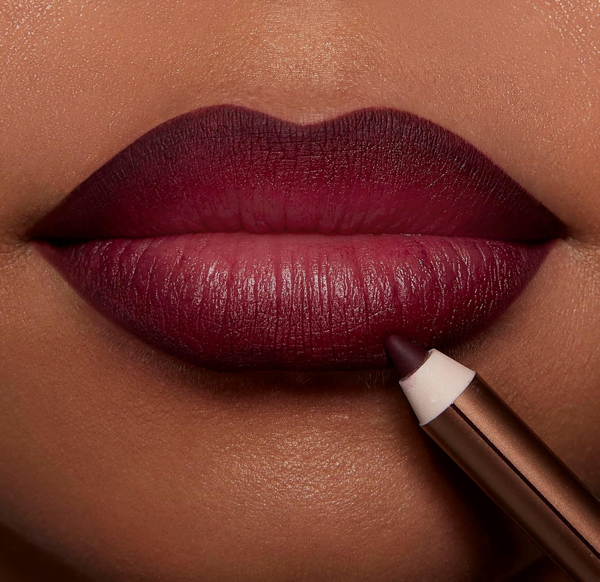 Smudge proof berry shade lip pencil for defining and reshaping lips