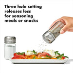 OXO glass spice shakers displayed on kitchen surface