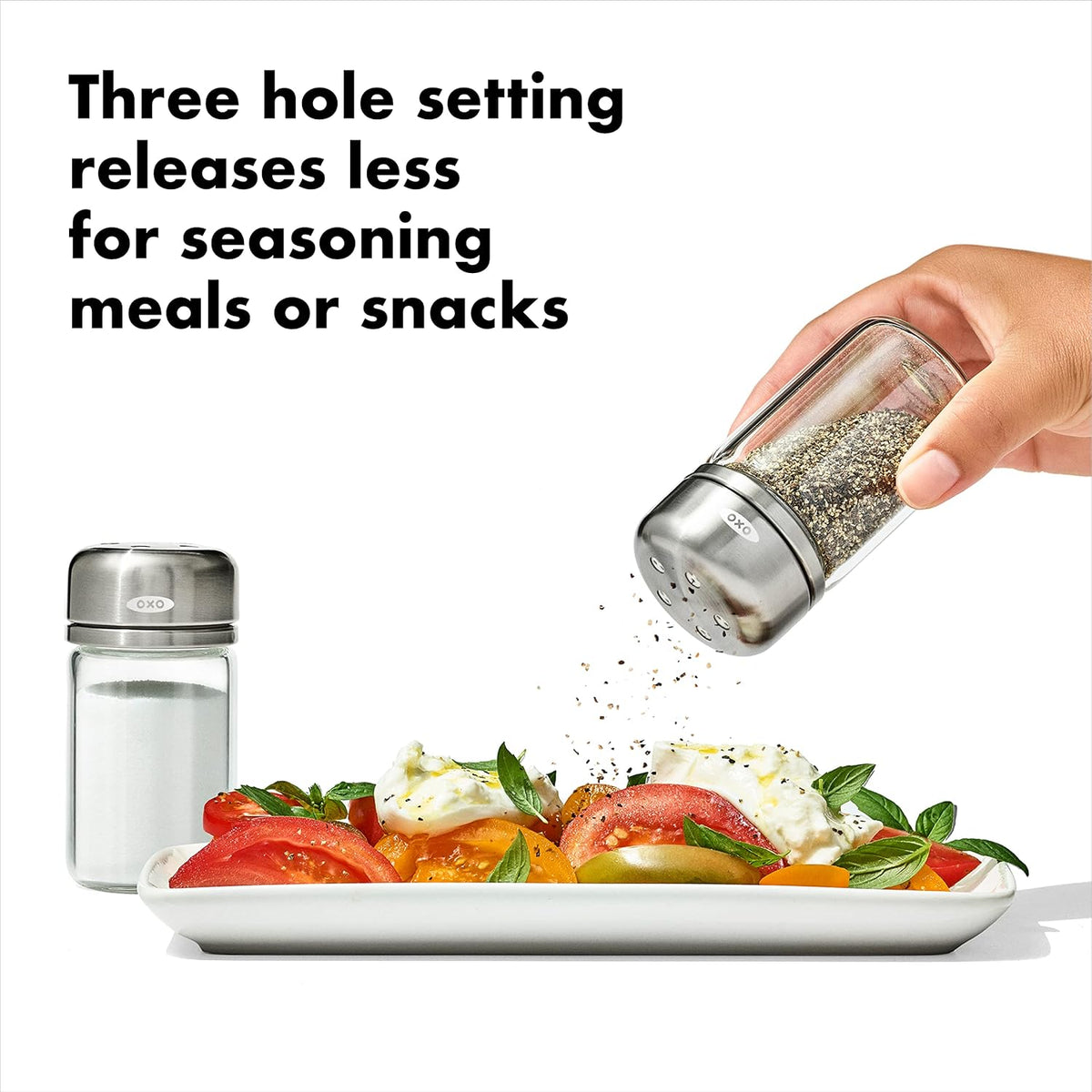 OXO glass spice shakers displayed on kitchen surface