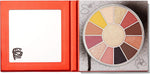 Close-up of the ultra-bright central highlighter inside the Milani 90s collaboration makeup palette.