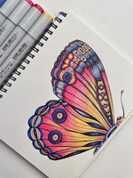 Too Copic Sketchbook S laying flat open on a table