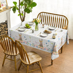 Horaldaily rectangular tablecloth laid out on a dining room table setup.