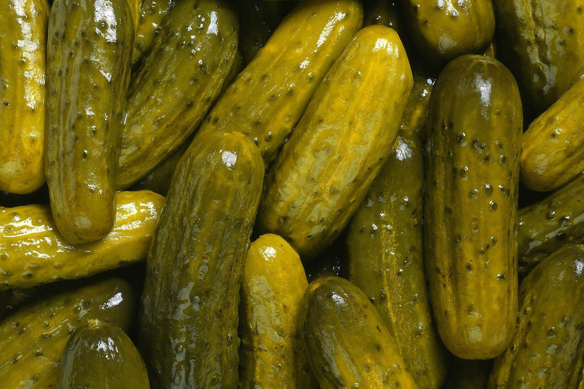Imported USA Christmas novelty pickle flavored hard candies individual packaging detail.