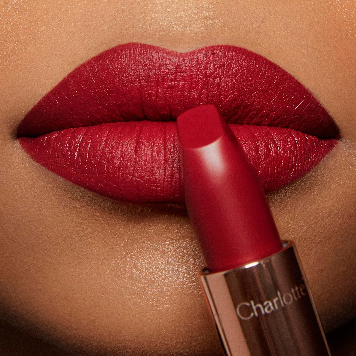 Model wearing Charlotte Tilbury Matte Revolution long lasting lipstick