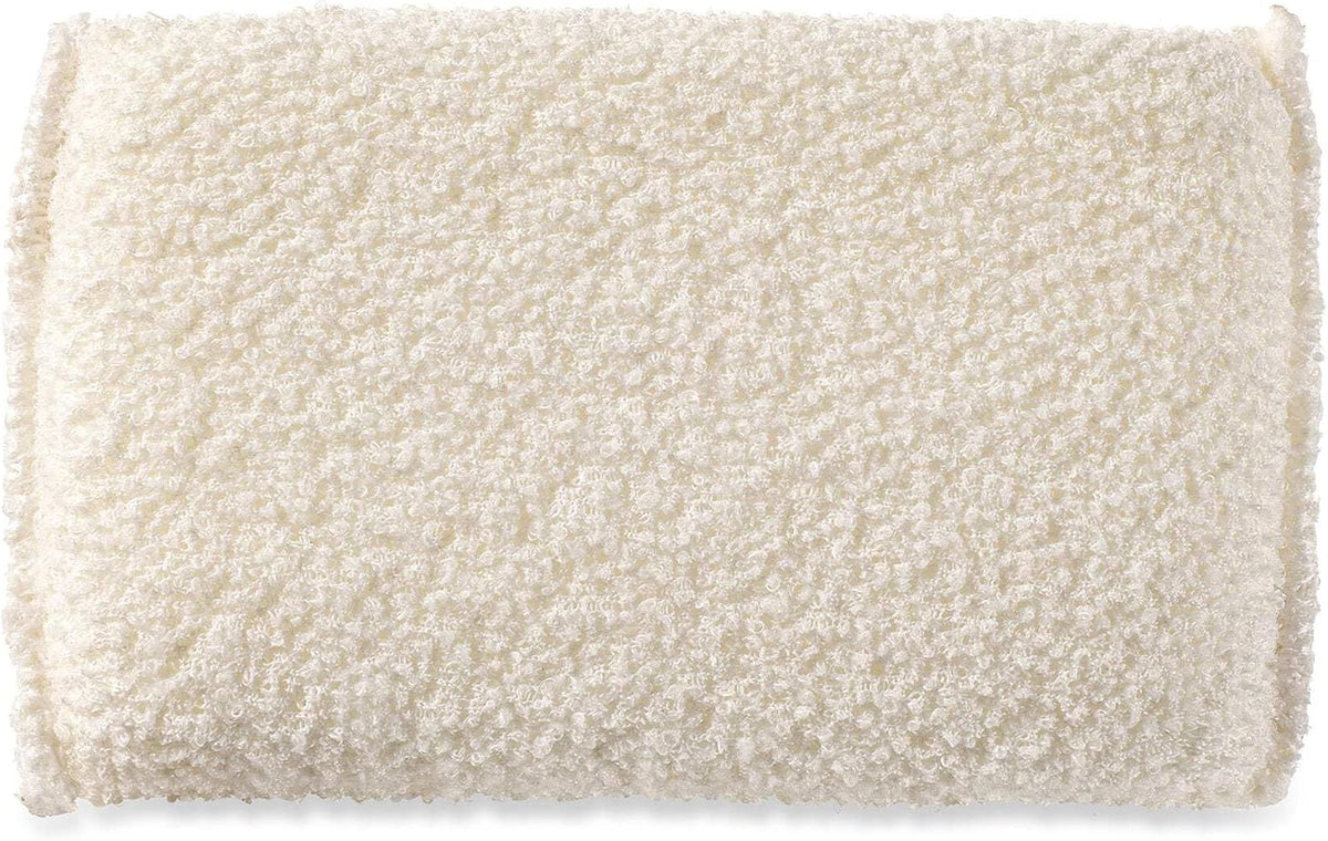 Organic cotton exfoliating sponge displayed for shower use
