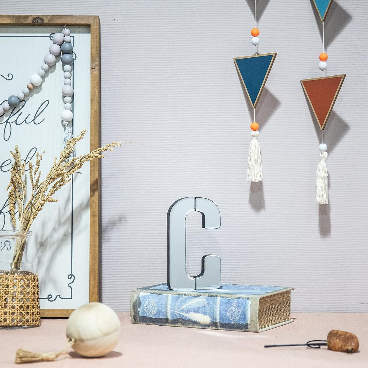 Collective Home decorative letter C close up showing glossy reflective surface