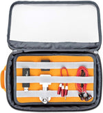 Lowepro GearUp Pouch Large packed with cables and tech accessories inside a backpack