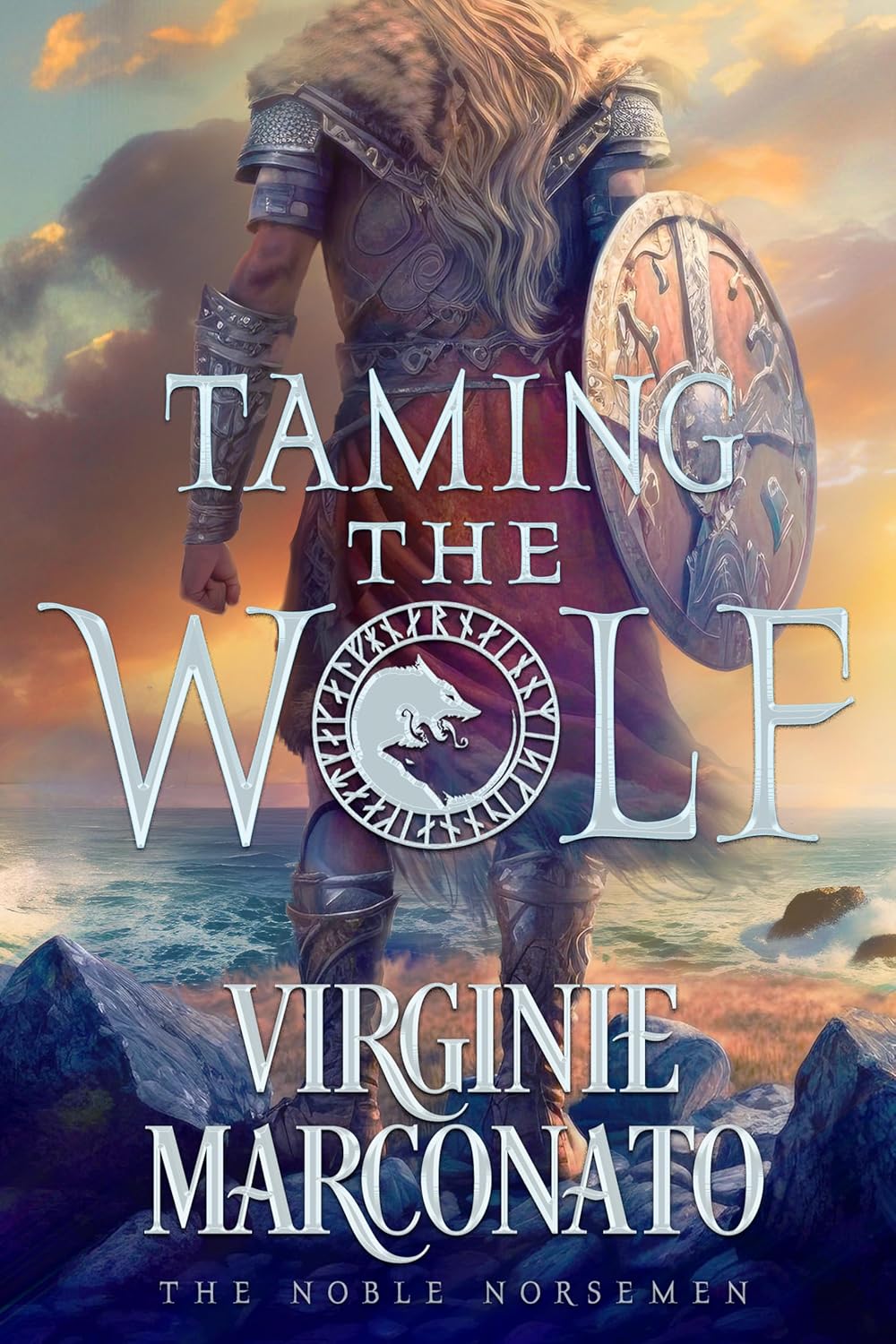 Virginie Marconato Taming the Wolf paperback book front cover view featuring a Viking warrior standing on a cliff at sunset.