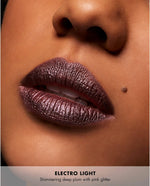 Milani holographic lip gloss shade swatch demonstrating light shifting prismatic technology