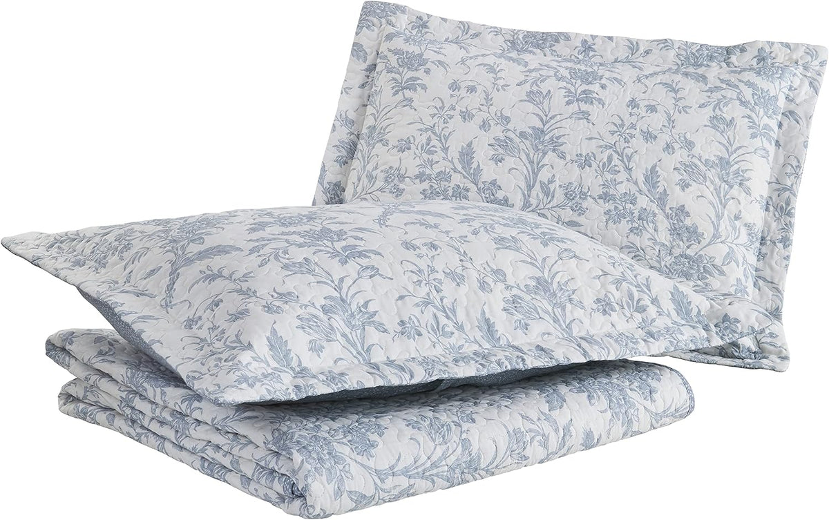 Laura Ashley twin quilt set styled on bedroom bed