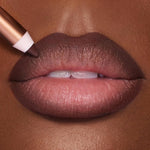 Charlotte Tilbury Lip Cheat velvety matte lip liner pencil swatched on a neutral surface.