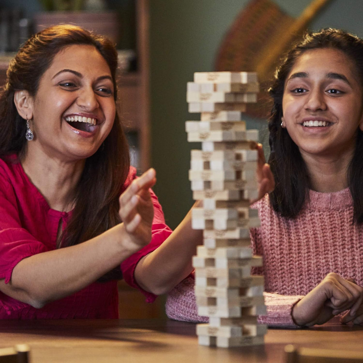 Hasbro Jenga wooden block game lifestyle action shot