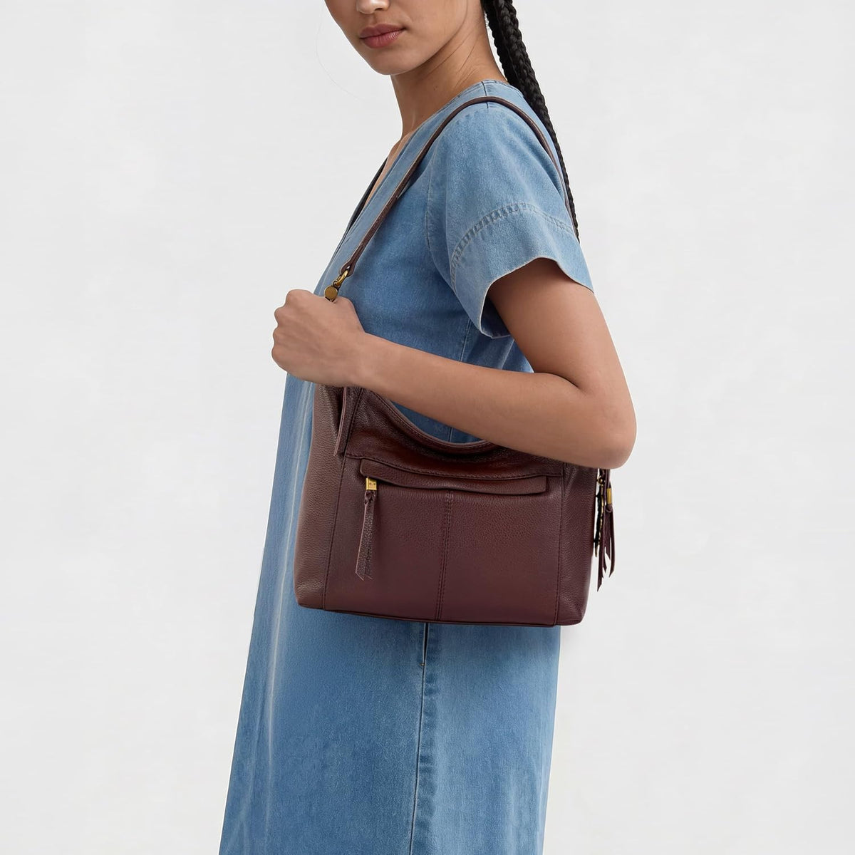 The Sak Alameda leather hobo bag side profile with tassel charm