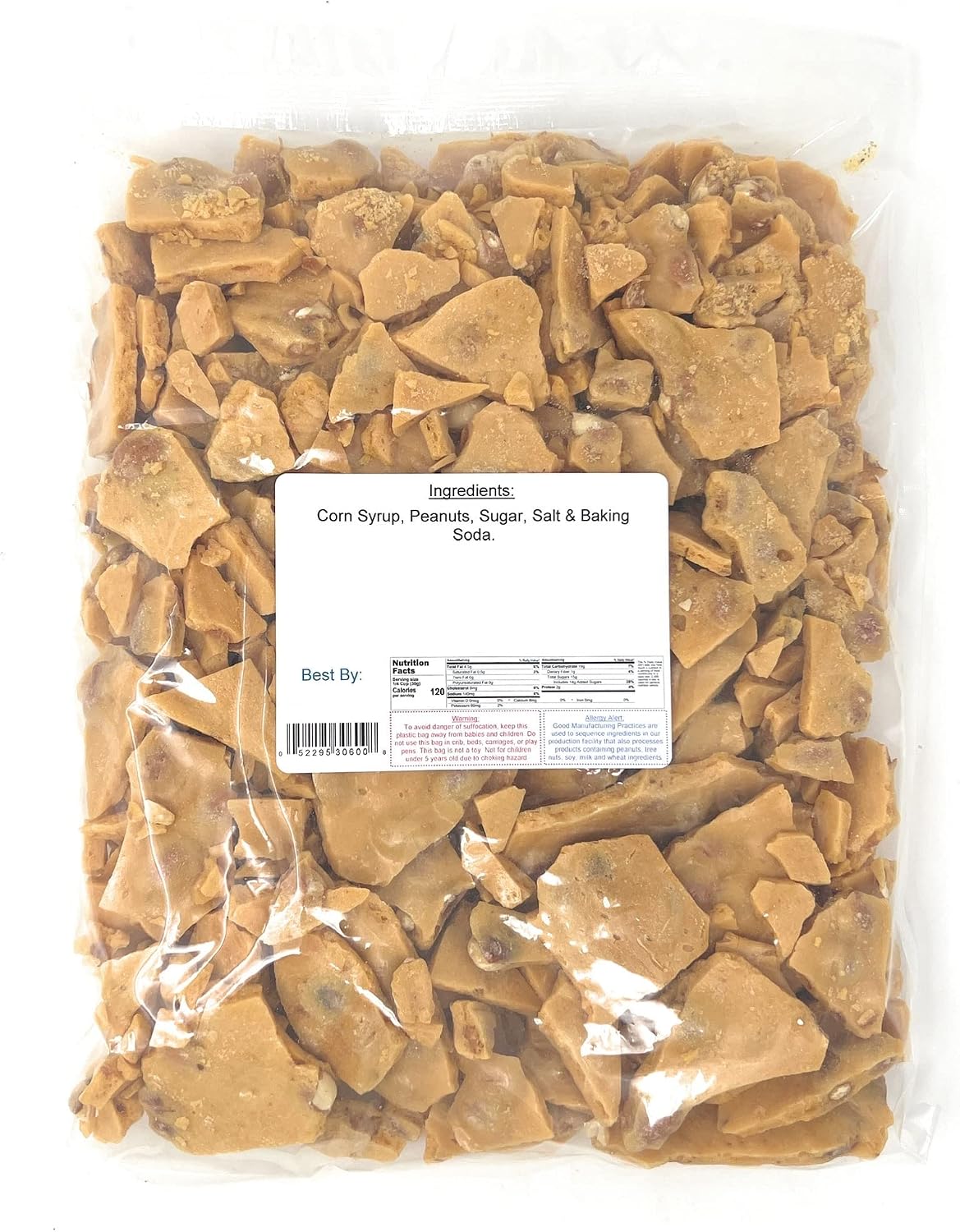 Old fashioned golden peanut brittle pieces loaded with jumbo peanuts