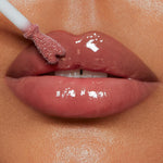 Model wearing Charlotte Tilbury Collagen Lip Bath for high shine finish