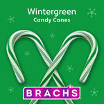 Close up of individually wrapped Brach's wintergreen flavored holiday candy sticks