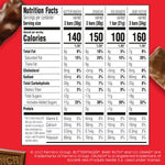 Assorted mini and fun size American chocolate bars scattered on a table.