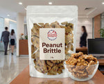 Side profile of crunchy peanut brittle showing butter toffee glaze