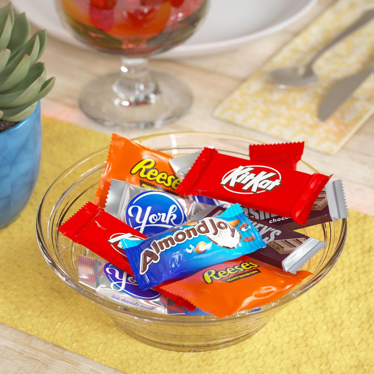 Premium imported Hershey's milk chocolate bars and peppermint patties in a decorative glass candy jar.