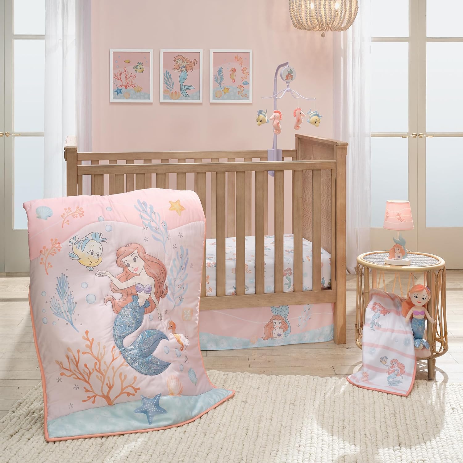 Bedtime Originals Disney Baby The Little Mermaid 3-Piece Baby Crib Bedding Set front view featuring Ariel quilt sheet and crib skirt.