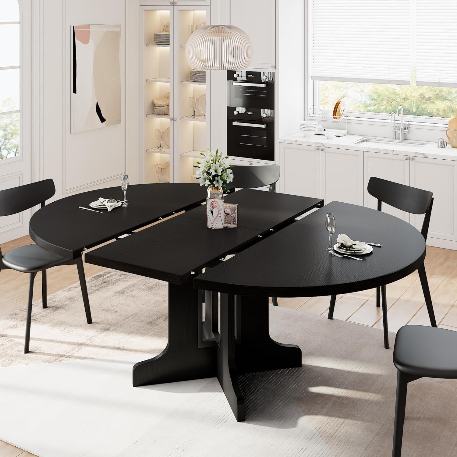 iPormis extendable round dining table front view showcasing the modern black finish and compact configuration.