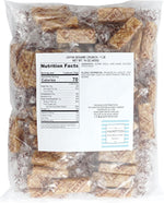 Close-up of golden honey sesame crunch candy bars showcasing toasted sesame seed texture.