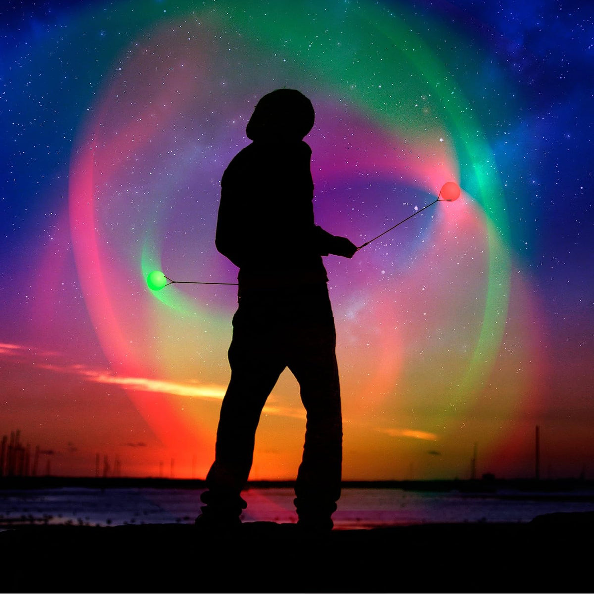 LED poi ball swirling light toy illuminated in a dark room setting