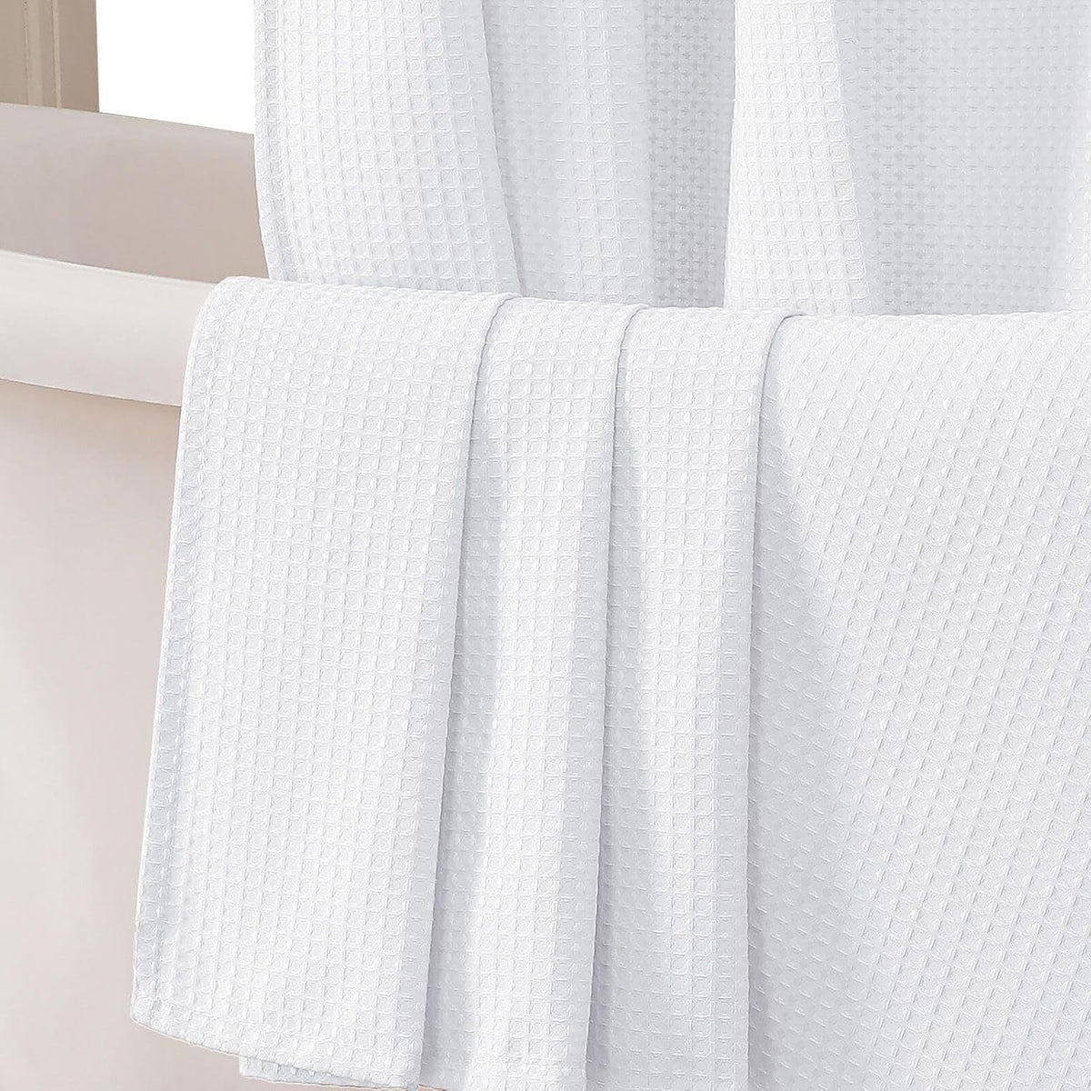 OWENIE white waffle weave fabric shower curtain front view hanging elegantly in a modern luxury bathroom.