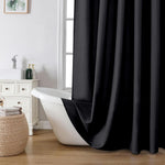 OVZME Zora solid black fabric shower curtain front view installed in bathroom