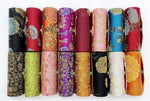 Compact travel organizer holding standard lipstick tubes