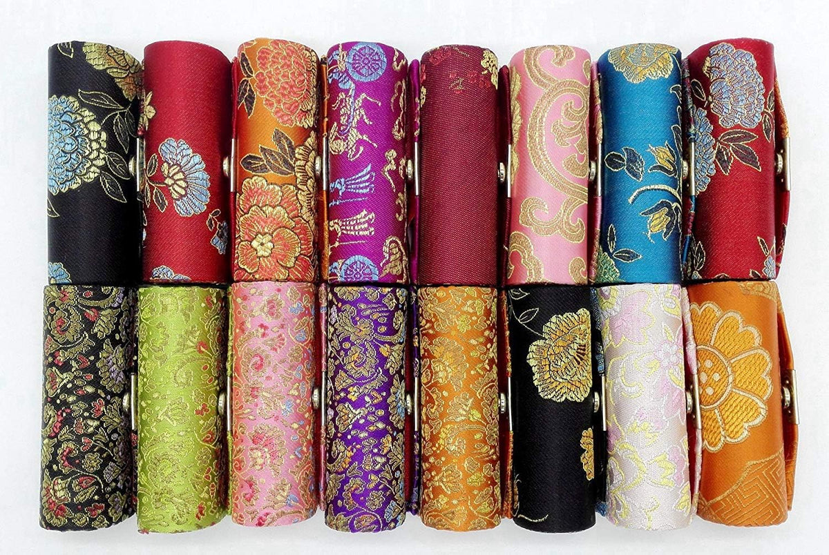 Compact travel organizer holding standard lipstick tubes