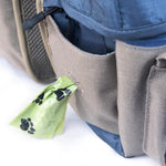 Close up of dog backpack harness buckle closure and side pockets