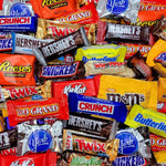 Close up of individually wrapped assorted chocolate candies in a bowl