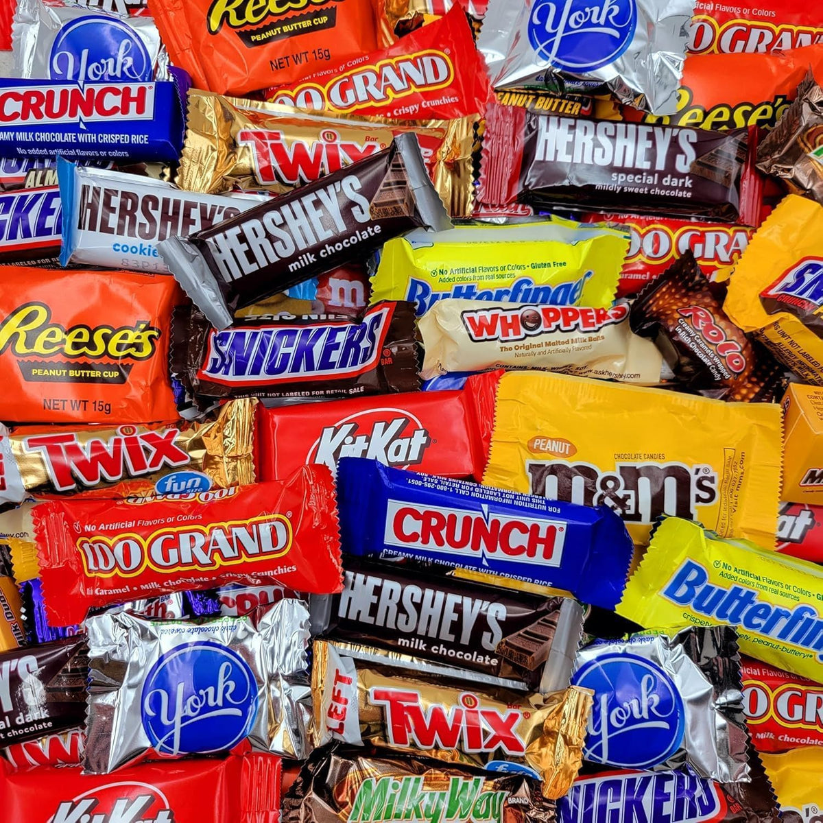 Close up of individually wrapped assorted chocolate candies in a bowl