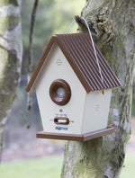 Dogtek ultrasonic birdhouse mounted on a tree outdoors