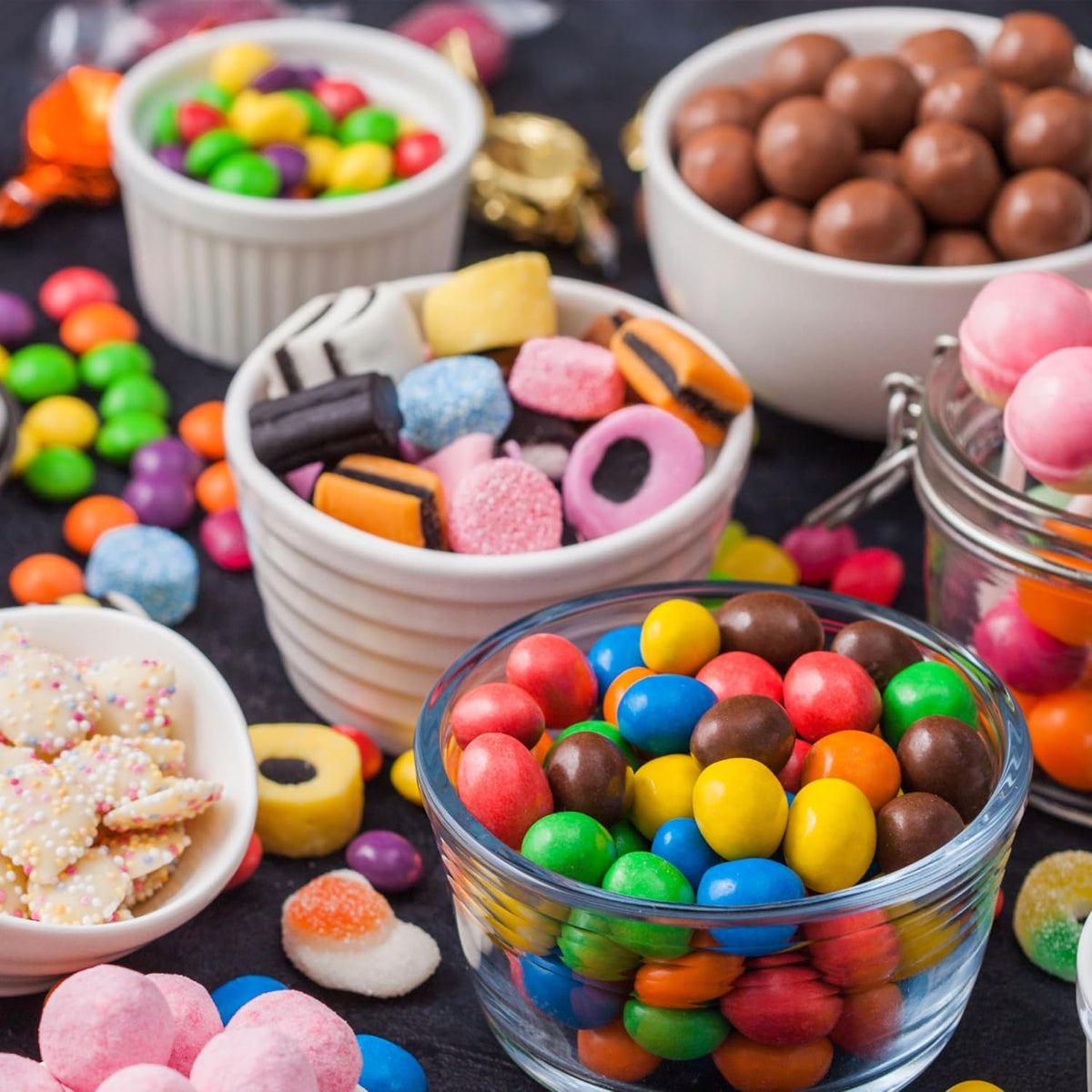 Assorted licorice candy mix pieces displayed on a holiday dessert table