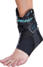 Aircast ankle support brace displayed with hand bulb inflation pump