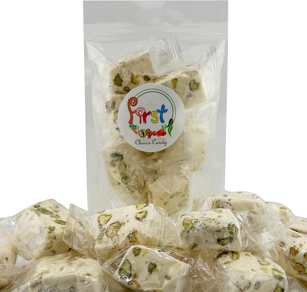 Close-up of a single soft white nougat candy showing real pistachio nut pieces.