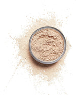 Cruelty free translucent mattifying face powder by Milani displayed open with sifter details.