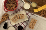 Close up of small batch handcrafted maple walnut candy fudge showing dense texture and crunchy walnut pieces.