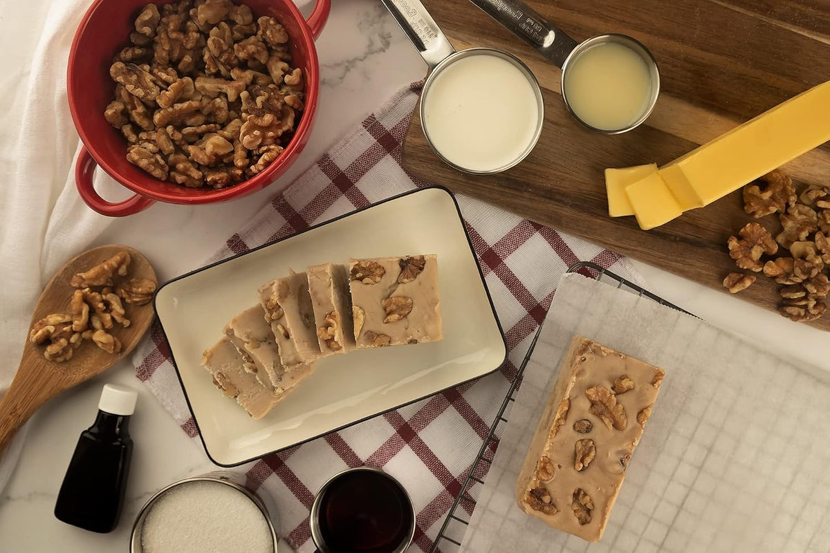 Close up of small batch handcrafted maple walnut candy fudge showing dense texture and crunchy walnut pieces.