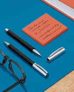Close up of the intricate guilloche engraving and chrome-plated metal clip on the Faber-Castell pen