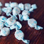 Premium USA imported digestive support lozenges close up of the individually wrapped vegan drops.