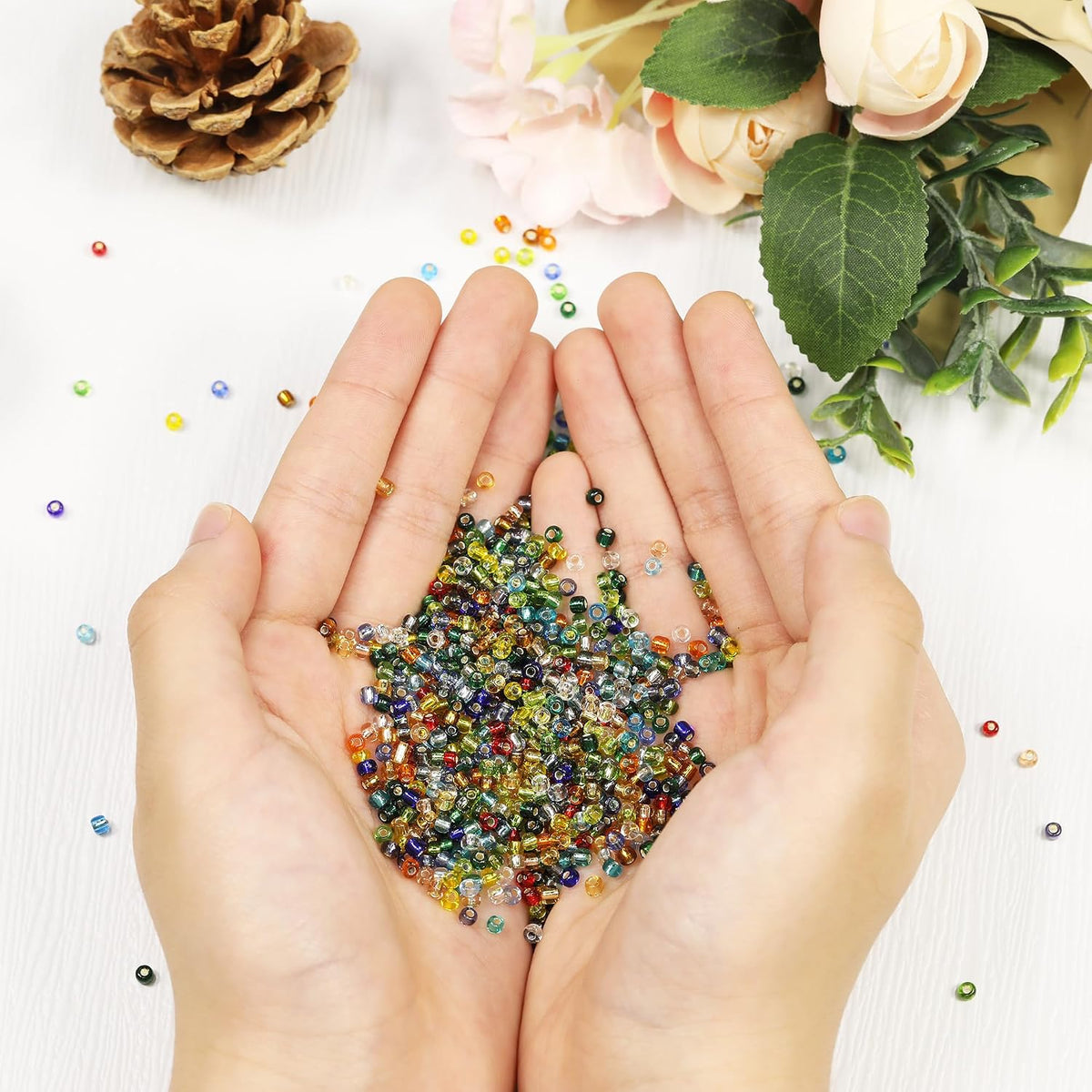 Kergaen 3mm seed beads demonstrated in a handmade jewelry crafting layout.