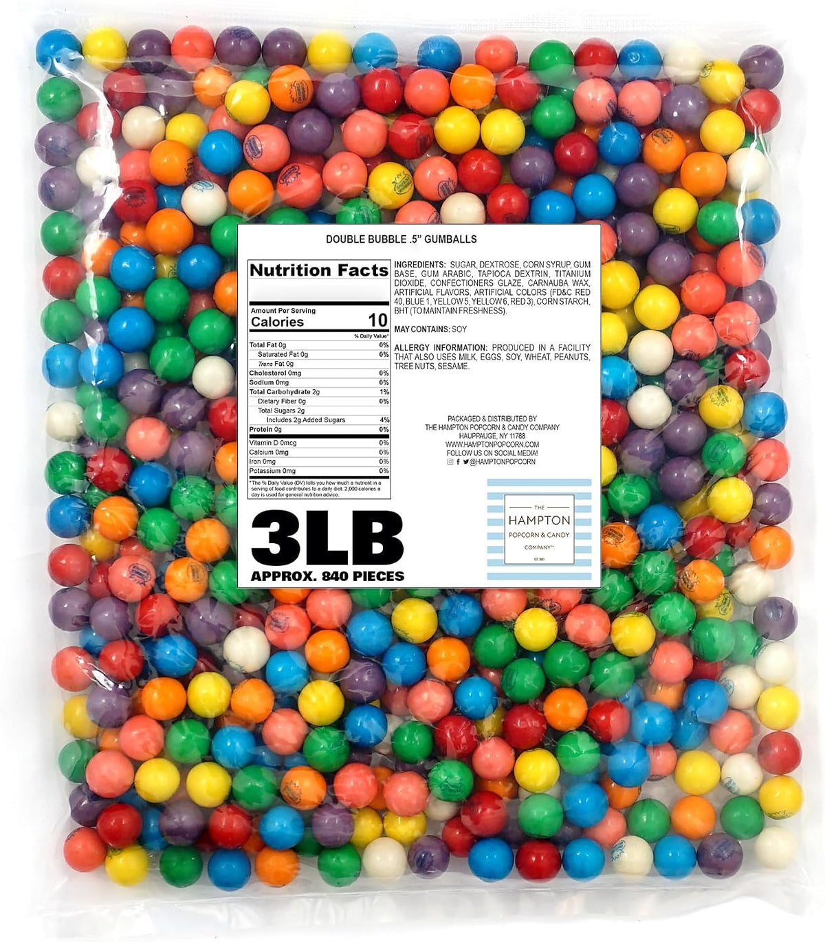 The Hampton Popcorn Company Assorted Fruit Flavored Gumballs spread out on a white surface showing uniform zero point five inch size