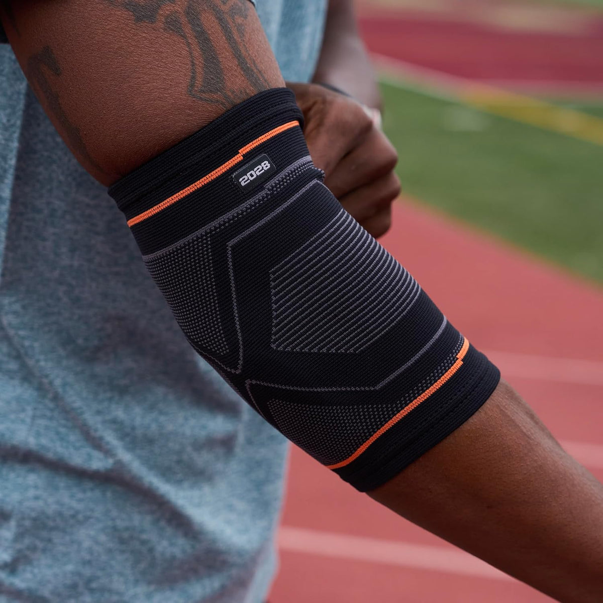 Shock Doctor elbow sleeve side profile showing elastic knit texture