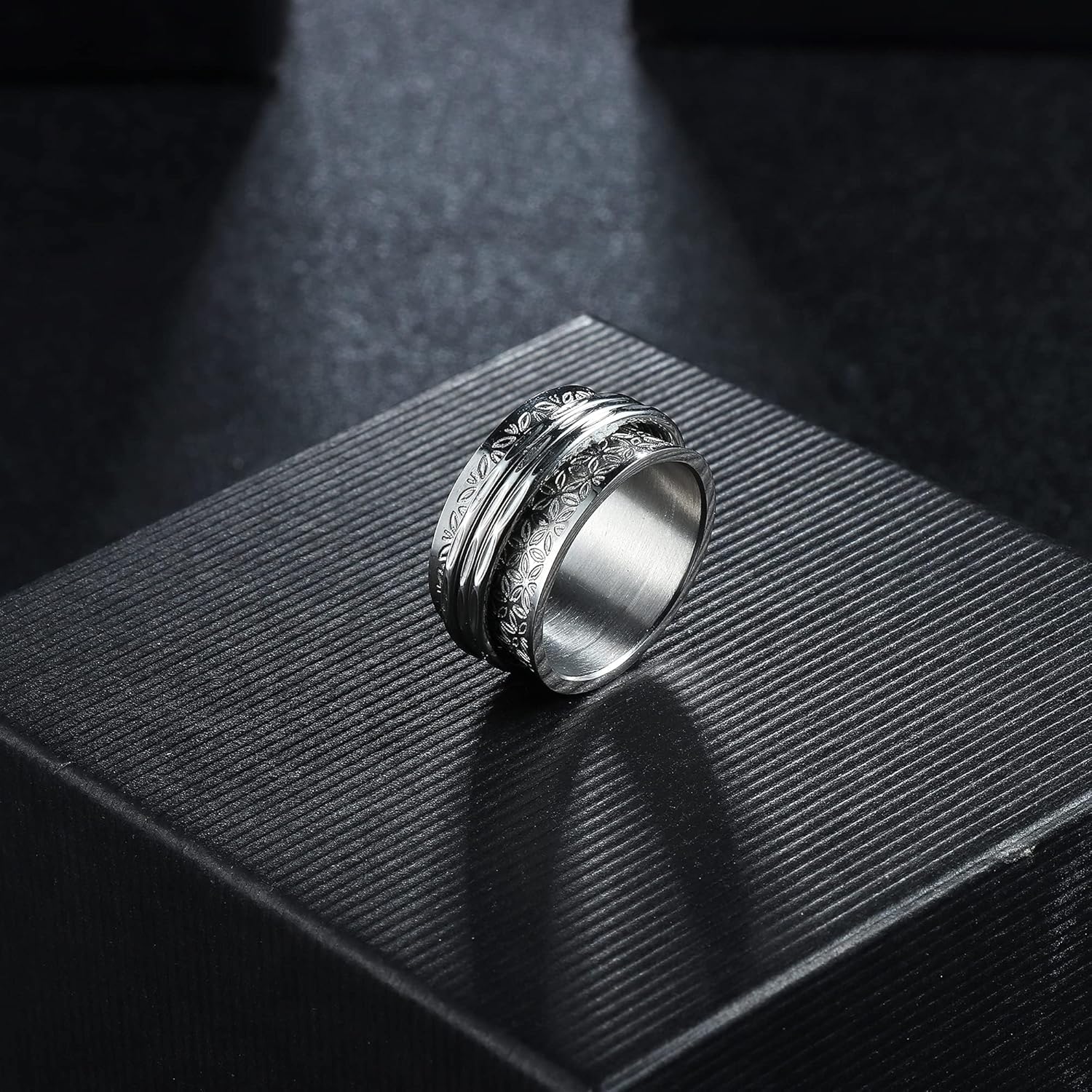 Magitaco stainless steel spinner rings set front view showcasing moon and star engraving details.